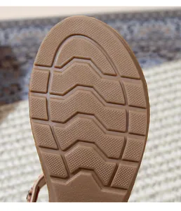 Detailed view of bohemian wedge sandals thick rubber sole with anti-slip wave pattern