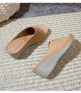 Detail of apricot wedge sandals with premium leather upper and non-slip sole texture