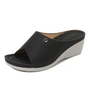Women's black wedge sandals with hollow-out cross straps and comfortable silver soles
