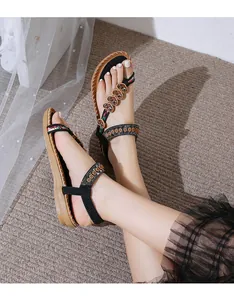 Bohemian flat sandals for women featuring heart charms and embroidery on black straps
