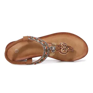 Bohemian wedge sandals for women with ethnic beads, rhinestones and T-strap on white background