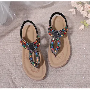 Detailed top view of Bohemian flat sandals with colorful beads and black gemstone