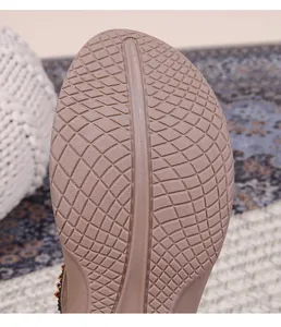 Close-up of lightweight flat sandal rubber sole featuring non-slip diamond texture