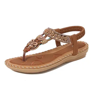 Bohemian brown flat thong sandals with rhinestone butterfly and braided strap details