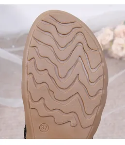 Macro shot of non-slip wavy sole texture and size 37 mark on flat bohemian sandals