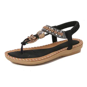 Bohemian flat sandals for women featuring rhinestone embellishments and a T-strap design