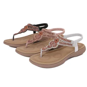 Women bohemian flat sandals with rhinestones and beads in black, gold, and silver colors