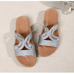 Top view of silver sequin woven cross straps on comfortable flat summer sandals for women