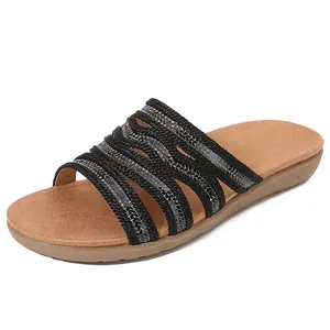 Women's flat bohemian slide sandals with hollow black straps and glitter detail