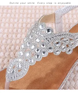 Detailed close-up of intricate rhinestone patterns on silver bohemian sandal straps