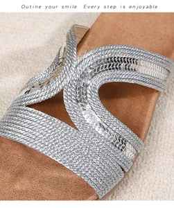 Detail of silver braided straps with sequins on bohemian flat sandals for women