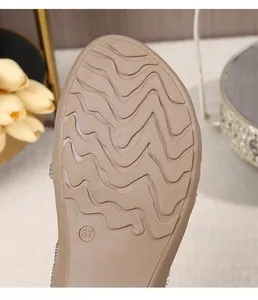 Close-up of bohemian sandal anti-slip rubber sole with size 37 mark and wave patterns