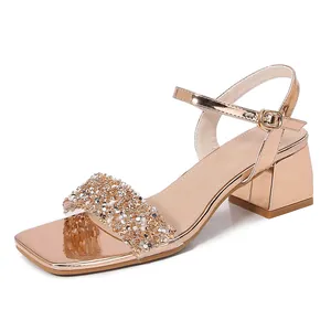 Rose gold platform sandals for women featuring rhinestone straps and chunky high heels