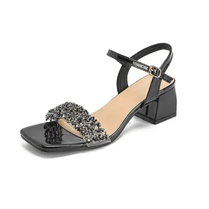 Black block heel sandals for women featuring rhinestone strap and square toe design