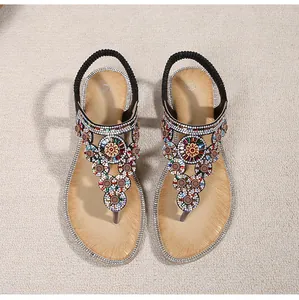 Top view of bohemian rhinestone flat sandals with colorful beads and elastic heel strap