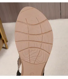 Detail view of anti-slip rubber outsole with size 37 engraving for wedge sandals