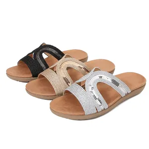 Flat bohemian rhinestone sandals in black, gold, and silver with hollow embroidered design