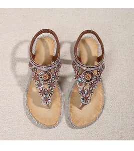 Top view of Bohemian flat sandals with colorful rhinestone floral patterns and elastic straps