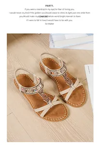 Detailed view of bohemian flat sandals with colorful beads, rhinestones, and butterfly decor