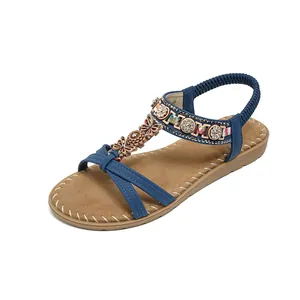Navy blue bohemian flat sandals with floral rhinestones and elastic heel strap