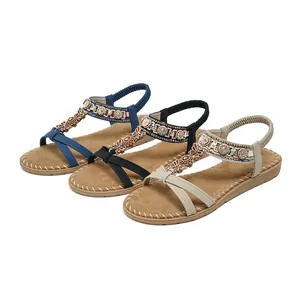 Women's rhinestone flat sandals with T-strap flower design in blue, black, and apricot