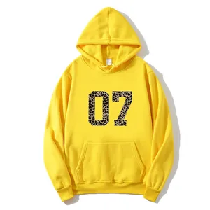 Bright yellow kangaroo pocket hoodie with leopard print number 07 and adjustable drawstring