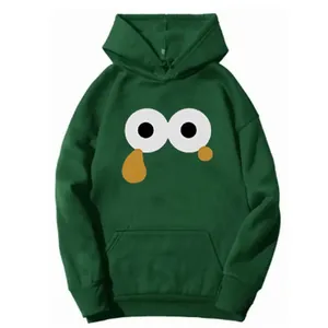 Detail of dark green hoodie featuring cartoon eye graphic and classic kangaroo pocket