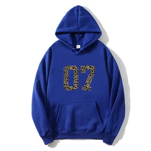 Detail of blue hoodie showing the leopard print 07 graphic and kangaroo pocket