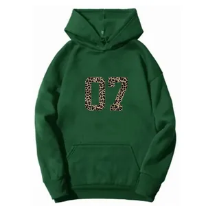 Detail of dark green hoodie featuring leopard print 07 number and kangaroo pocket