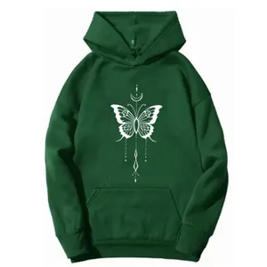 Detailed close-up of white butterfly art print and kangaroo pocket on dark green hoodie