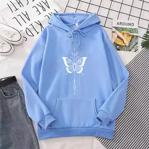 Detailed view of light blue hoodie featuring white bow and moon art print design