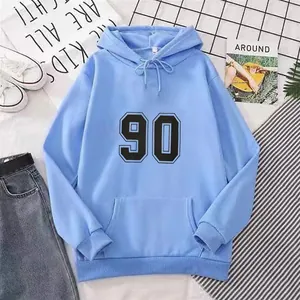 Detail of light blue hoodie featuring number 90 print with ribbed cuffs and kangaroo pocket