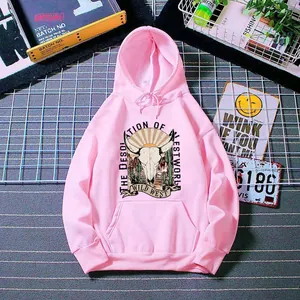 Detail of pink hoodie featuring American vintage wild west desert sunset and skull print
