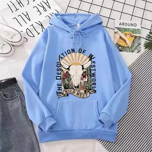 Close-up of light blue hoodie featuring vintage wild west bull skull and cactus print