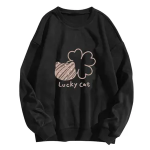 Detail of loose black sweatshirt featuring Lucky Cat graphic with ribbed cuffs and hem