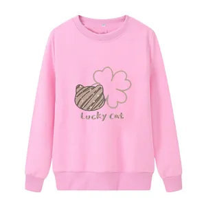 Detailed view of pink sweatshirt with Lucky Cat print, ribbed cuffs and collar label