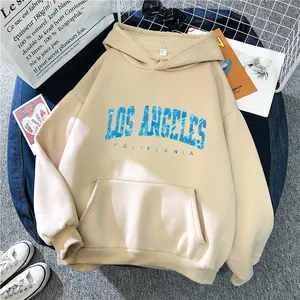Detail of Los Angeles print on oversized beige hoodie with kangaroo pocket and drawstrings