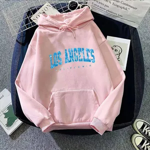 Detailed view of pink hoodie with blue Los Angeles text print and ribbed cuffs