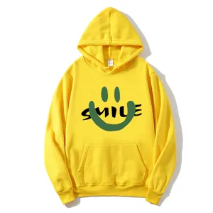 Oversized yellow hoodie with green smiley face print and kangaroo pocket for women