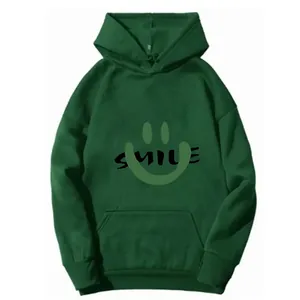 Detail of dark green hoodie featuring a SMILE print with graphic face and kangaroo pocket