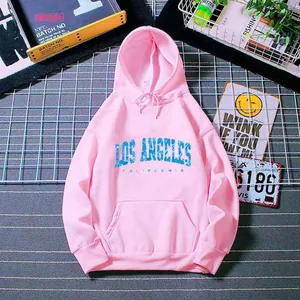 Flat lay detail of pink Los Angeles hoodie featuring kangaroo pocket and drawstring hood