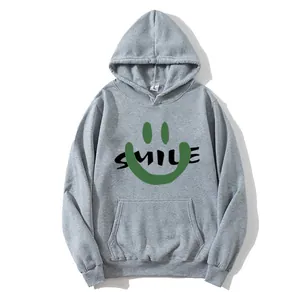 Detail of grey hoodie showing a green smile face print and white neck size label L