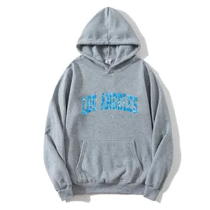 Detail of Los Angeles print on gray hoodie featuring size L label and soft fabric