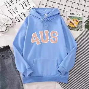 Flat lay of a light blue oversized 4US hoodie with denim jeans and casual sneakers