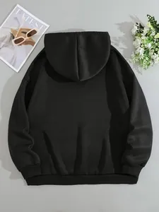 Hoodie noir oversize à épaules tombantes posé à plat avec détails de bords-côtes