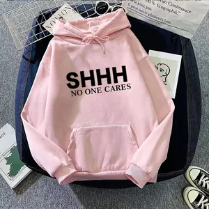 Pink oversized hoodie with 'SHHH' print, drawstring hood and pocket in a flat lay style