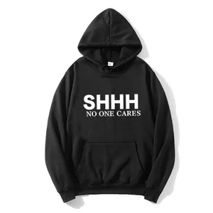 Detail view of cotton hoodie fabric with Shhh No One Cares print and kangaroo pocket