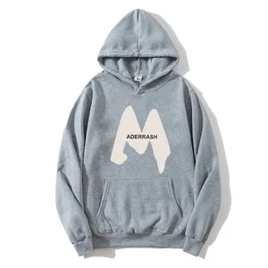 Close-up of grey hoodie with M and ADERRASH lettering and fleece lining detail
