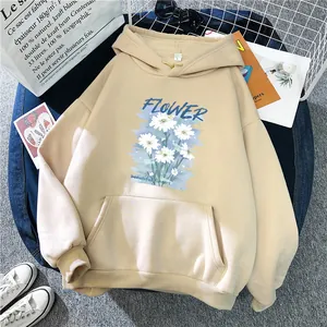 Detailed view of apricot oversized hoodie with daisy flower print and kangaroo pocket