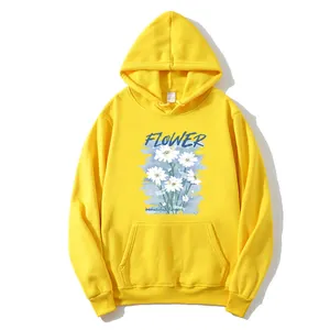 Bright yellow oversized hoodie for women featuring a blue flower print and daisy design